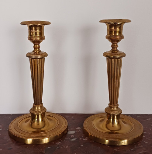 Paris, late 18th century - pair of small gilded bronze candlesticks or torches - late Louis XVI period