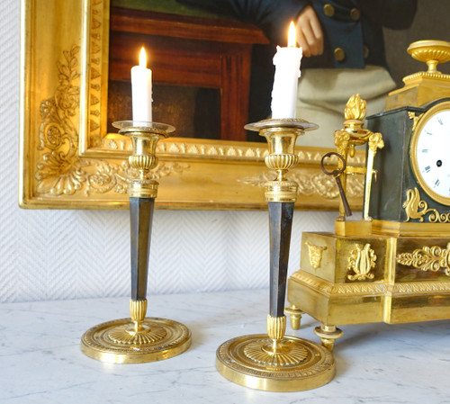 Pair of Empire gilt and patinated bronze candlesticks by Ravrio, early 19th century