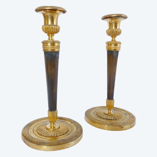 Pair of Empire gilt and patinated bronze candlesticks by Ravrio, early 19th century