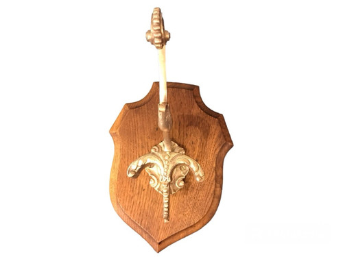 Louis XVI style bronze coat hook on wood from the 19th century