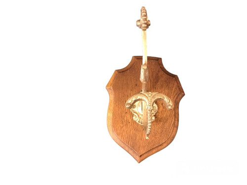 Louis XVI style bronze coat hook on wood from the 19th century