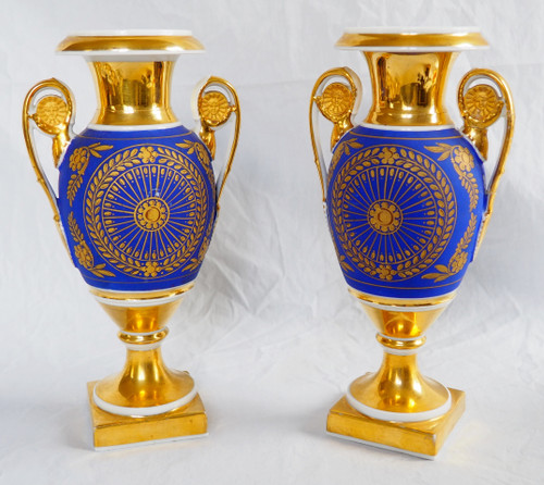 Pair of Empire period vases in Paris porcelain and biscuit, blue and gold polychrome decoration