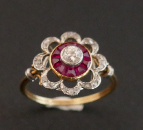 Ring Decorated With A Diamond, Surrounded By Calibrated Rubies.