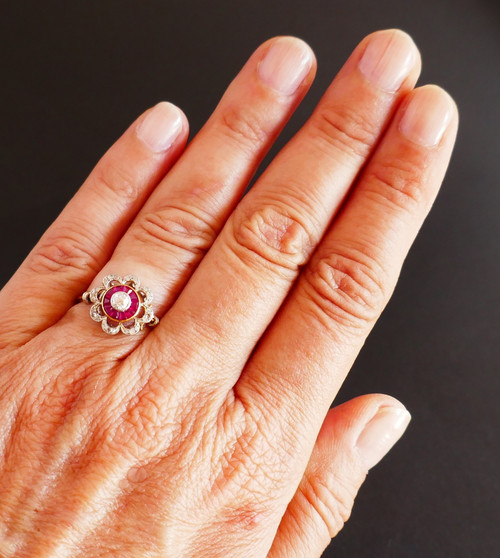 Ring Decorated With A Diamond, Surrounded By Calibrated Rubies.