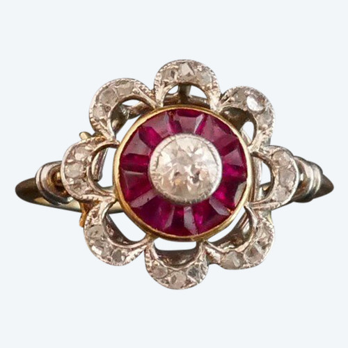 Ring Decorated With A Diamond, Surrounded By Calibrated Rubies.