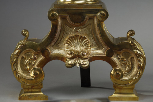 PAIR OF ORMOLU AND CHASED ANDIRONS DECORATED WITH SEATED MUSES