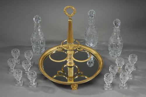 CHARLES X PERIOD LIQUOR SERVICE IN GILT BRONZE AND CUT CRYSTAL