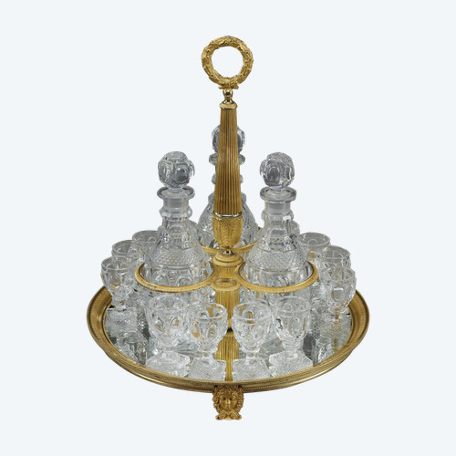 CHARLES X PERIOD LIQUOR SERVICE IN GILT BRONZE AND CUT CRYSTAL