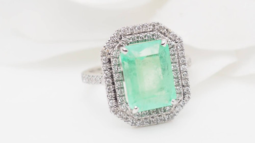 Double-encircled ring in white gold, certified Colombian emerald and diamonds