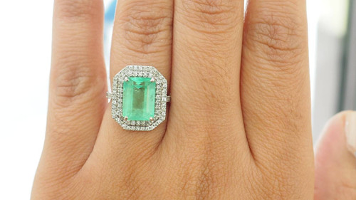 Double-encircled ring in white gold, certified Colombian emerald and diamonds