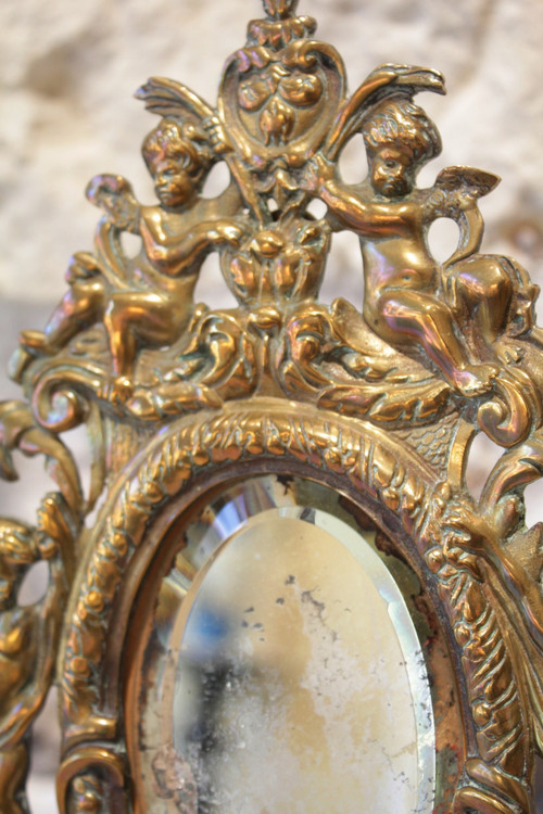 Miroir en bronze à décor d'angelots et mascarons fin 19ème siècle