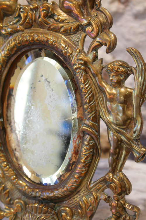 Miroir en bronze à décor d'angelots et mascarons fin 19ème siècle