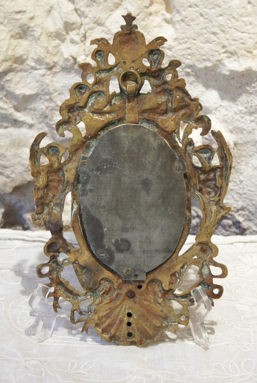 Miroir en bronze à décor d'angelots et mascarons fin 19ème siècle