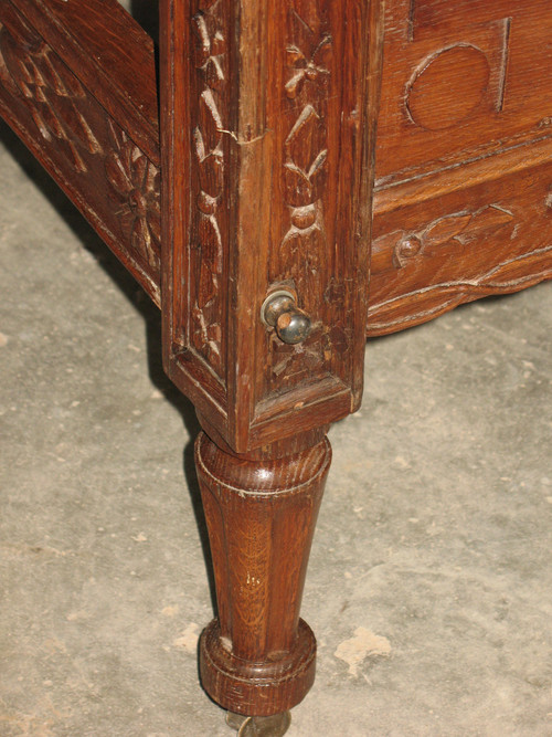 Late 18th century carved oak alcove bed complete with rails and casters