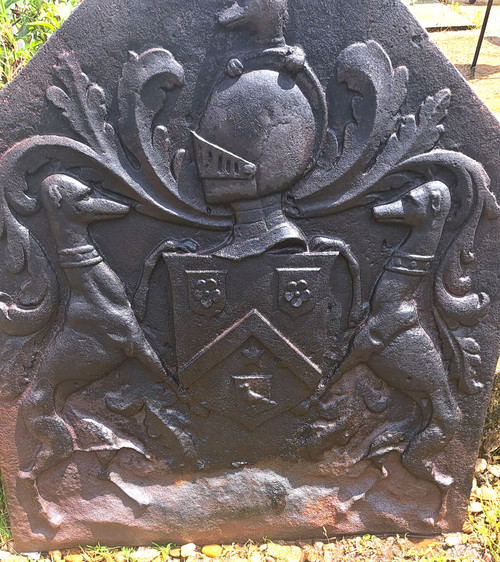 Cast iron fireback with canted sides framed by greyhounds 18th century