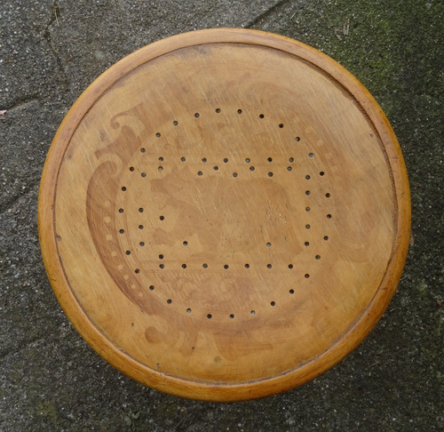 Low blond bistro stool, circa 1920, wooden seat