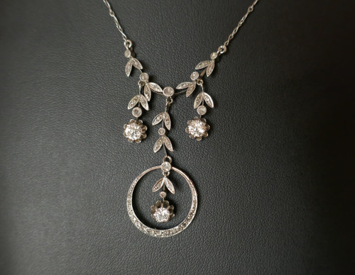 Drapery necklace set with diamonds.