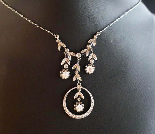 Drapery necklace set with diamonds.