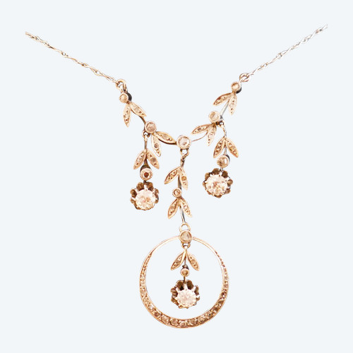 Drapery necklace set with diamonds.