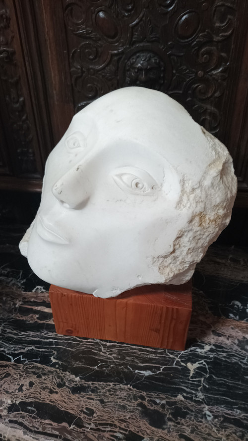 Face bust stone sculpture