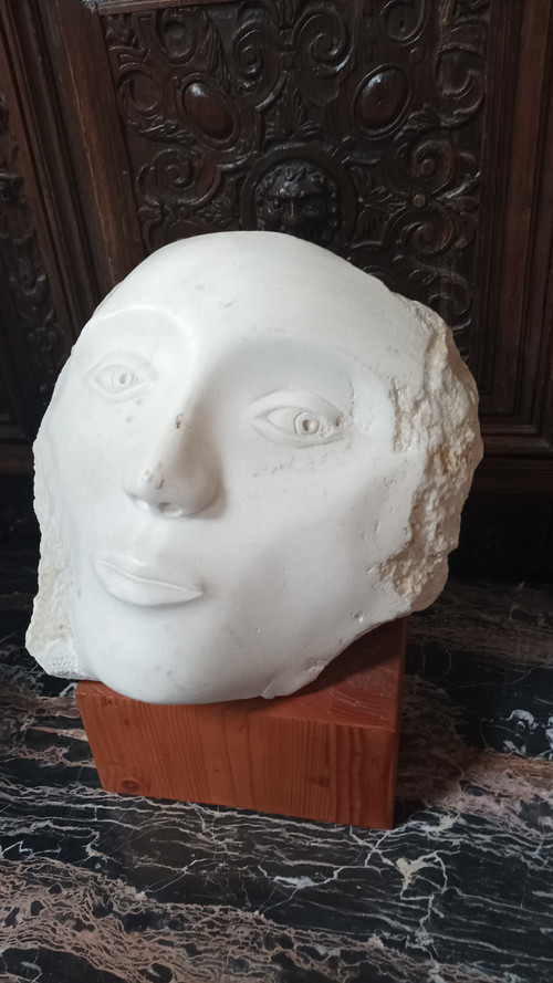 Face bust stone sculpture