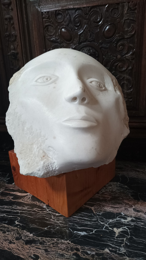 Face bust stone sculpture