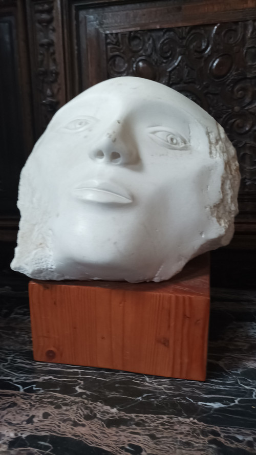 Face bust stone sculpture