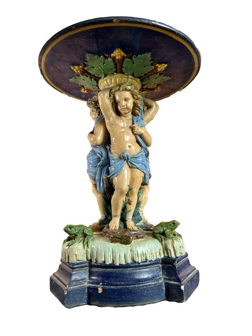 Centerpiece decorative tray decorated with putti in slip