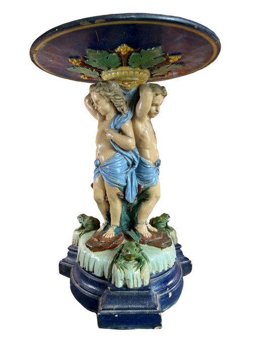 Centerpiece decorative tray decorated with putti in slip