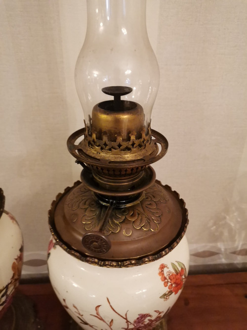 Pair of earthenware oil lamps with pink flower decoration, 19th century