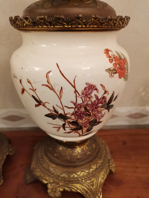 Pair of earthenware oil lamps with pink flower decoration, 19th century