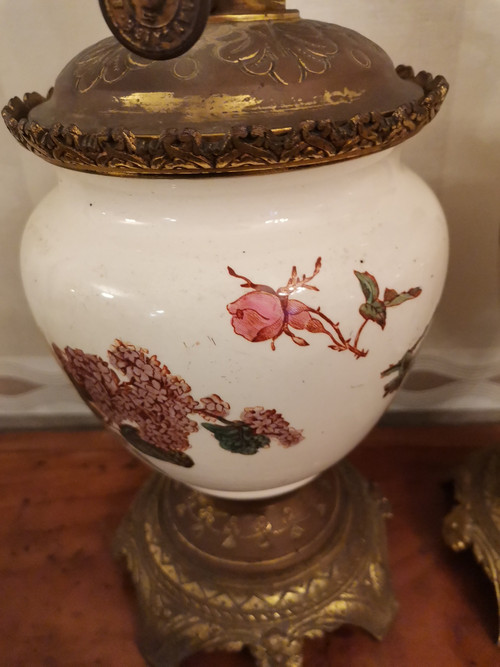 Pair of earthenware oil lamps with pink flower decoration, 19th century