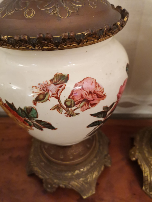 Pair of earthenware oil lamps with pink flower decoration, 19th century