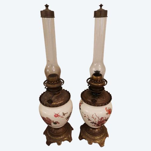 Pair of earthenware oil lamps with pink flower decoration, 19th century