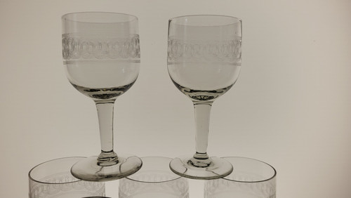 7 19th century guilloche wine glasses