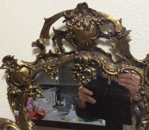 Louis XV style gilt bronze contour mirror