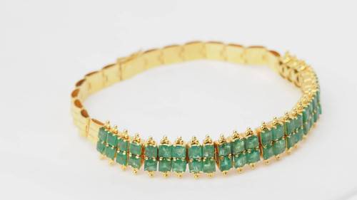 Antique flexible bracelet in yellow gold and emeralds