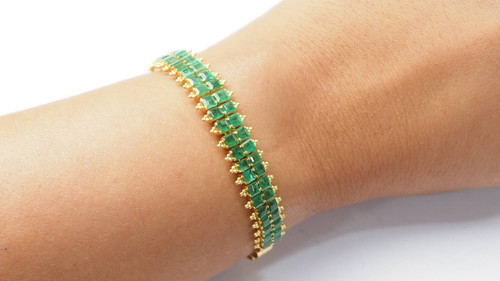 Antique flexible bracelet in yellow gold and emeralds