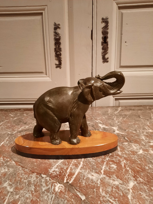 Regulated elephant on marble base.