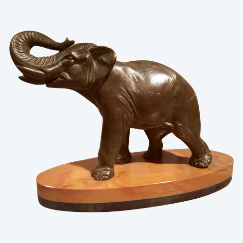 Regulated elephant on marble base.