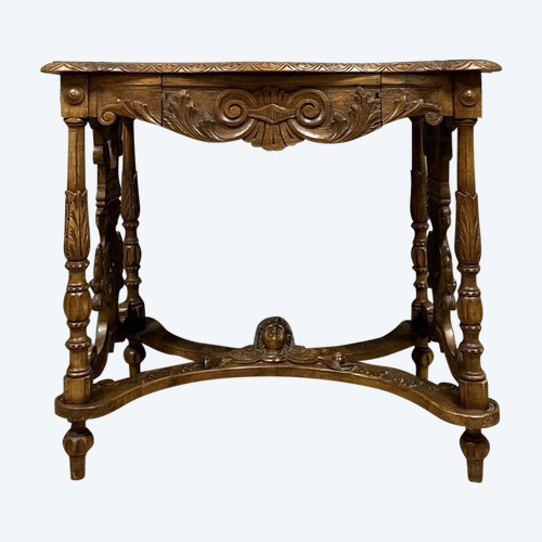 double-sided Renaissance desk in walnut carved with plant motifs