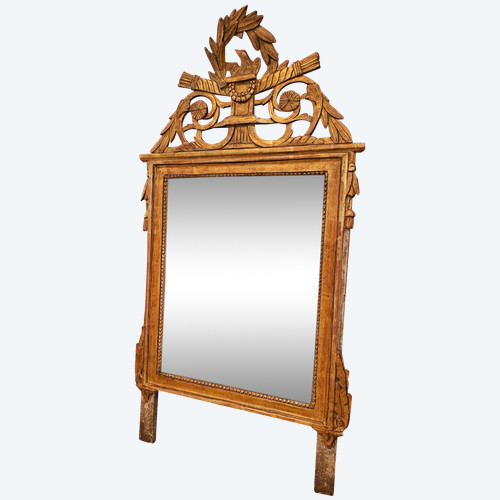 Louis XVI period mirror in carved and gilded wood.