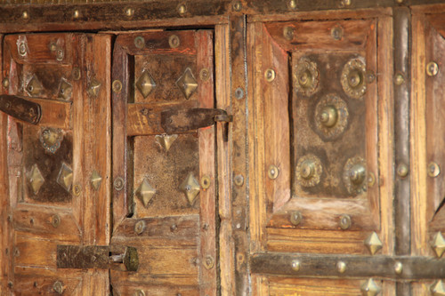 Asian wooden furniture inlaid with brass buttons and plates 