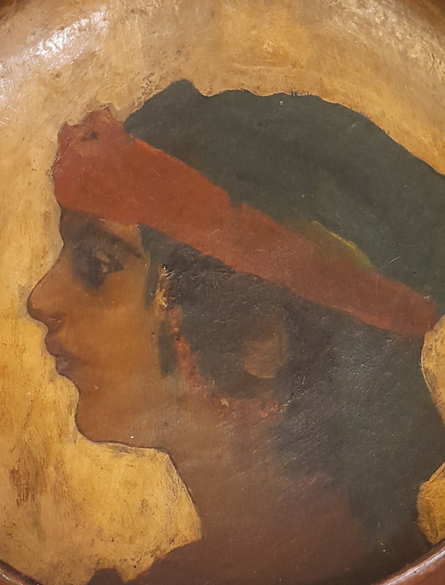 Portrait of a young orientalist woman painted on terracotta dish circa 1900/1930