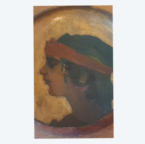 Portrait of a young orientalist woman painted on terracotta dish circa 1900/1930