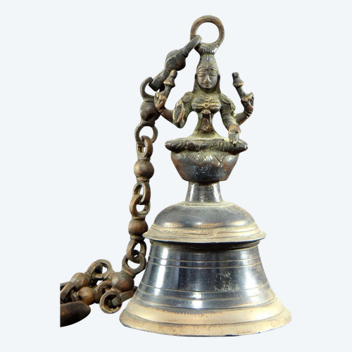 India, Mid-20th Century, Bronze bell adorned with a representation of the goddess Tripura.