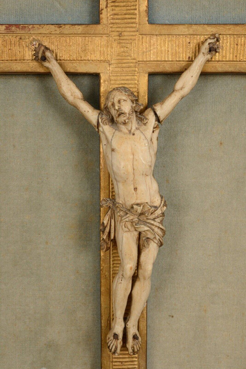 18th-century hand-carved Christ, gilded wood frame, floral decoration