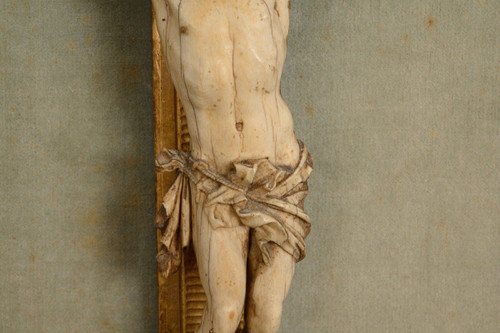 18th-century hand-carved Christ, gilded wood frame, floral decoration