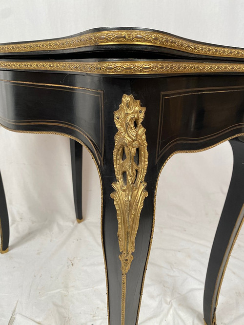 Napoleon III console forming a games table, blackened wood and brass marquetry