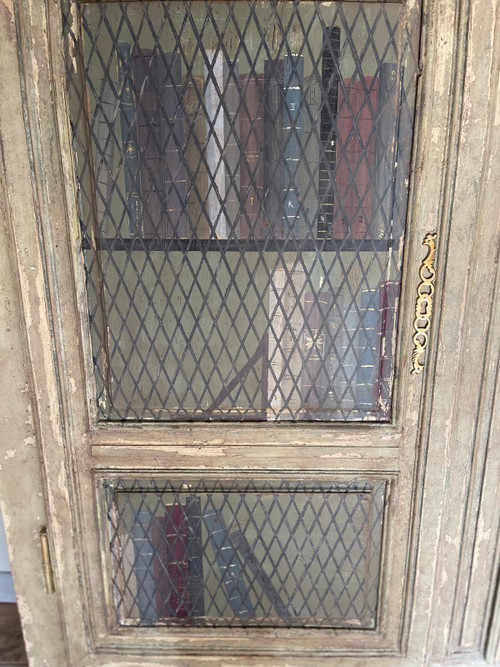 Late 19th century patinated wooden bookcase with trompe l’oeil